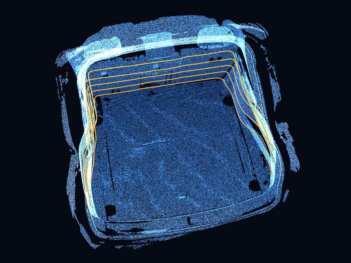 The scanned load space seen from above, with amber contour lines tracing the shape of its usable space at several heights.